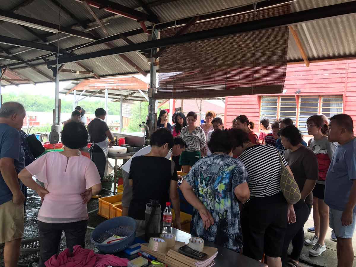 Visitors from Klang Valley, the are buying fresh seafood at Sungai Yu Fishery Kuala Selangor